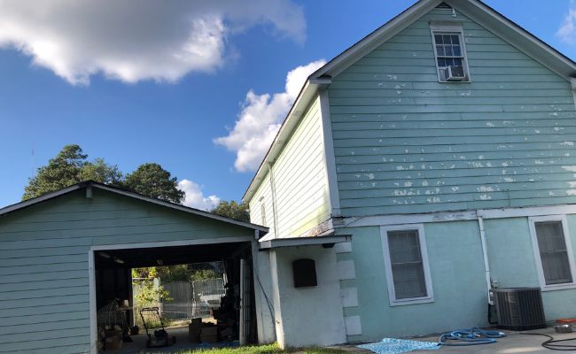 Picture windows on a white house.