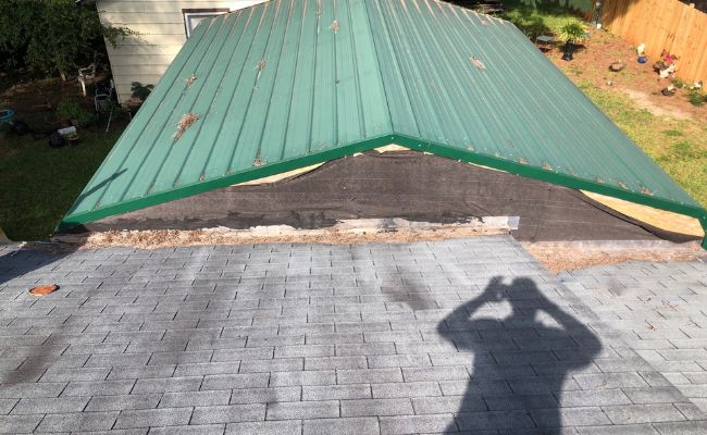 Picture windows on a white house.