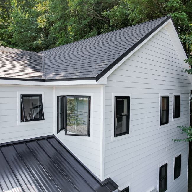 Picture windows on a white house.