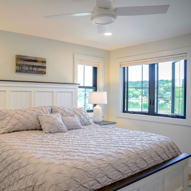 Picture windows on a white house.