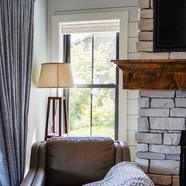 Picture windows on a white house.