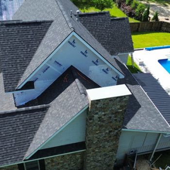 expert-vinyl-siding-installed-near-me-columbia-south-carolina-affordble-prices Aerial view of a home with new roofing and house wrap installed.